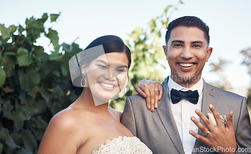 Image of Wedding, ring and hand with couple in portrait with happiness for celebration in a garden for a ceremony. Marriage, man and woman celebrate their love and commitment in an outdoor event with a smile.