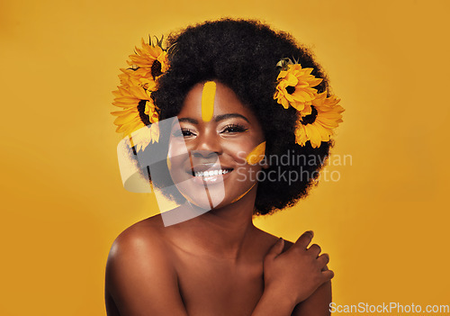 Image of Makeup, sunflower and happy with portrait of black woman in studio for beauty, creative or spring. Natural, cosmetics and floral with face of model on yellow background for art, self love or glow