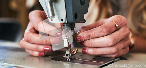 Image of Workshop sewing machine, woman hands and fashion designer with button and thread work. Small business, entrepreneur and female tailor with boutique and employee working with machinery for clothing