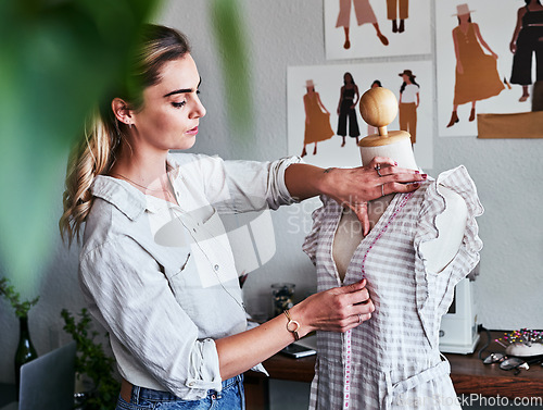 Image of Fashion, sustainable business and woman designer with mannequin, measuring tape and creative startup. Focus, creativity and tailor with dress on doll, eco friendly design on clothes in textile studio