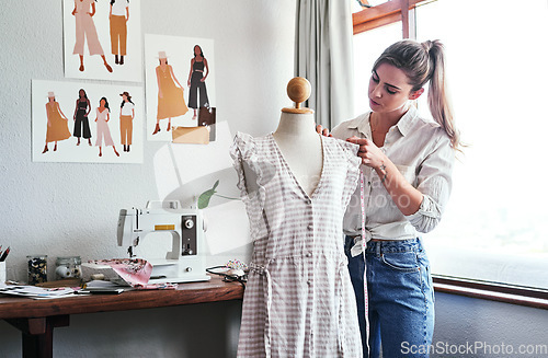 Image of Fashion, design and woman with mannequin, measuring tape and sewing machine at creative small business. Focus, creativity and tailor with dress on doll for clothes, designer in textile startup studio