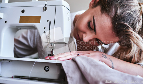 Image of Fashion, design and closeup of woman at sewing machine, small business ideas, creativity and focus in studio. Creative startup, textile designer or tailor stitching fabric, young entrepreneur at work