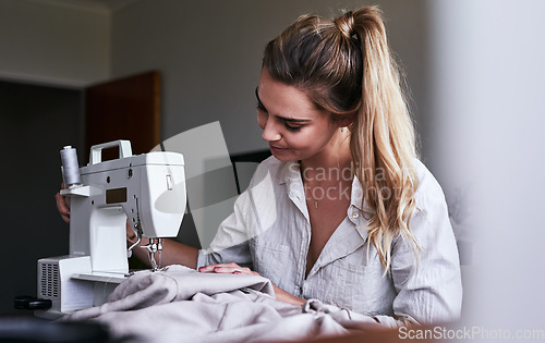 Image of Fashion, fabric and sewing, woman at machine in small business with creative ideas and focus at home studio. Creativity, startup and design, tailor or designer stitching, young entrepreneur at work.