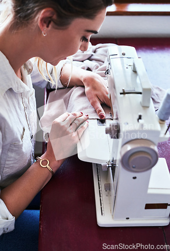 Image of Fashion, textile and happy woman at sewing machine from above for small business ideas and focus in studio. Creativity, start up and designer, tailor or entrepreneur at table stitching fabric at desk