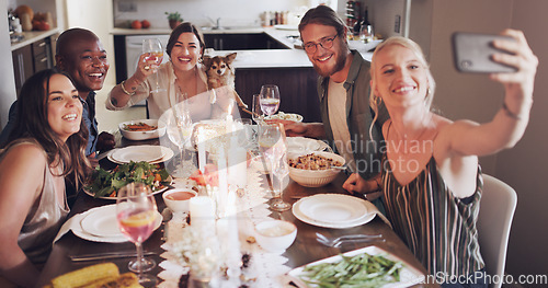 Image of Diversity, dining table and friends taking a selfie at dinner, party or event at a modern home. Happy, smile and young people taking a picture together while eating a lunch meal with wine in a house.