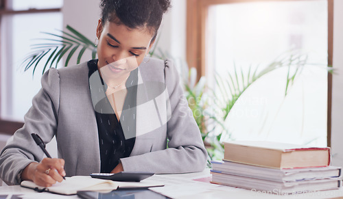 Image of Business woman, calculator and writing in notebook on desk for finance budget, accounting or planning. Female admin accountant with books, pen and list for tax on financial profit or income in office