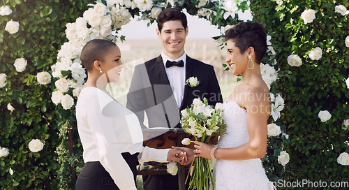 Image of Wedding, commitment and happy lesbian couple at altar with smile, love and minister for ceremony. Lgbt marriage, celebration and happy woman with bride, diversity and lgbtq pride, happiness for women