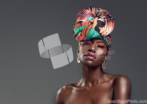 Image of Fashion, beauty and portrait of black woman in makeup on gray background for glamour, cosmetics and luxury. Studio, designer and face of female person in exotic jewelry, African style and head scarf