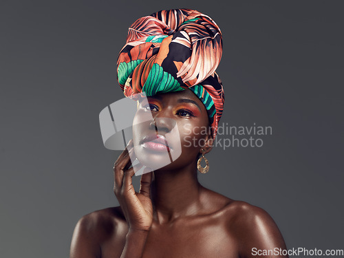 Image of Makeup, beauty and face of black woman in studio on gray background with glamour, cosmetics and luxury. Fashion, thinking and serious female person in exotic jewelry, African style and head scarf