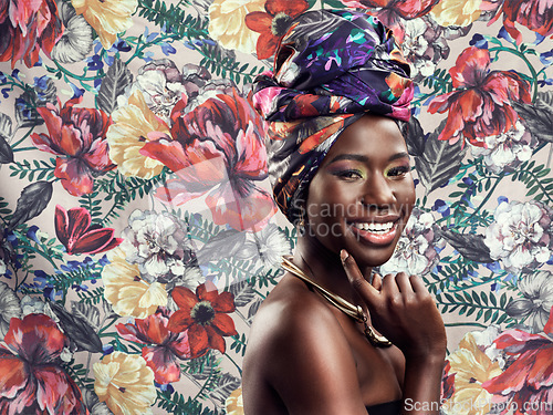 Image of Makeup, fashion and portrait of black woman on flower background with glamour, cosmetics and fashion. Floral pattern, happy and face of female person in exotic jewelry, African style and head scarf