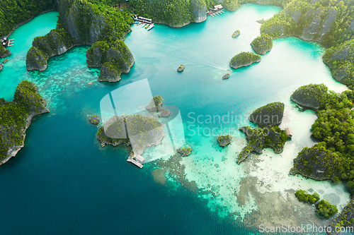 Image of Travel, aerial and ocean on island for holiday, adventure and vacation on Raja Ampat in Indonesia. Nature, seascape and drone view of tropical water for landscape, environment or traveling on islands