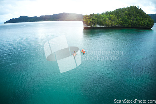 Image of Adventure, people canoeing and in river on an island together. Summer vacation or holiday break, freedom or journey and couple out on sea paddling on water with mock up space in tropical ocean