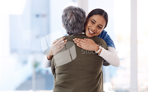 Image of Healthcare, hug and nurse with senior woman, care and diagnosis with positive news, help and happiness. Female person, employee or medical professional with patient, lady and embrace for consultation