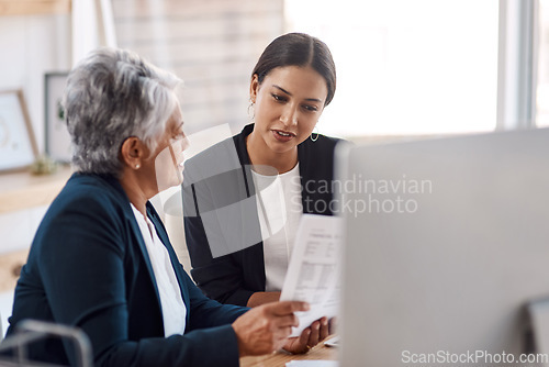 Image of Mentor, coaching or business women with documents talking, speaking or planning project in office. Paperwork, teamwork collaboration or senior manager reading with intern for administration training