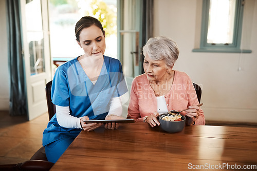 Image of Elderly woman, nurse and breakfast tablet for reading, video or news online for focus together in nursing home. Retirement, women and digital touchscreen at table for food, nutrition info or diet app