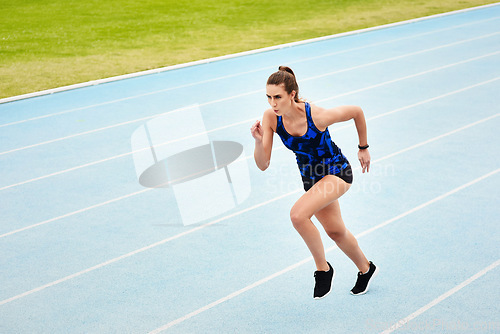 Image of Woman, running and stadium track for fitness, exercise or workout for cardio training outdoors. Fit, active or sporty female person, runner or athlete in sprinting competition, exercising or race