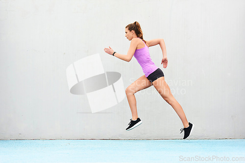 Image of Woman, fitness and running on mockup for workout, cardio training or healthy exercise outdoors. Fit, active and sporty female person or runner exercising for health and wellness on wall mock up space