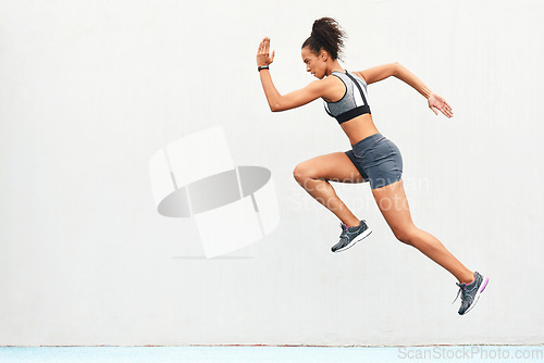 Image of Woman, fitness and running on mockup for sports in cardio training, workout or healthy exercise. Fit, active or sporty female person or runner exercising for health and wellness on wall mock up space