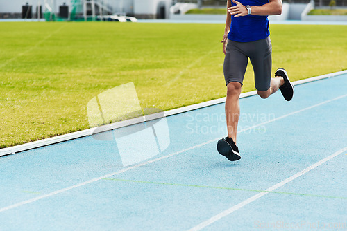 Image of Man, legs and running on stadium track for fitness, workout or exercise of athlete training outside. Leg of male person or runner exercising in run, athletics or sports competition for healthy cardio