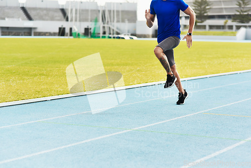 Image of Man, legs and running on track for fitness, workout or exercise of athlete training at the stadium. Leg of male person or runner exercising in run, athletics or sports competition for healthy cardio