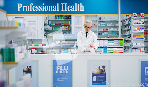 Image of Pharmacy package, elderly man and chemist reading pharmaceutical, supplements or product info. Typing, store medicine and male pharmacist research supplement prescription information for healthcare