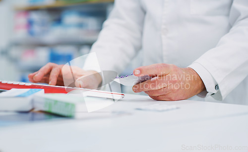 Image of Pharmacy pills, computer keyboard and person hands typing, research and search product info on drugs store database. Dispensary service, hospital medicine and chemist enter supplement information