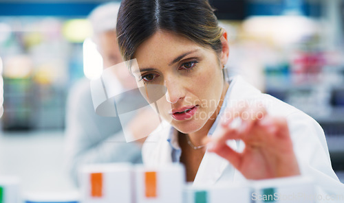 Image of Pharmacy customer, store shelf and woman help client with clinic pills, medicine product or prescription drugs. Retail stock check, healthcare and female pharmacist search for pharmaceutical box