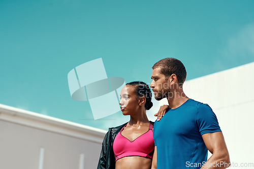 Image of Fitness, woman and man with blue sky, mockup at outdoor gym for health and wellness with sports space. Workout, exercise and personal trainer with athlete, focus and healthy mindset for summer goals.