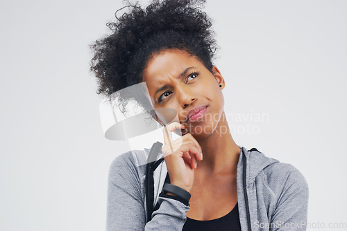 Image of Black woman, serious and isolated thinking of fitness, workout idea or planning exercise and health goals. Girl, think or plan decision for training, gym or remember sport ideas on white background