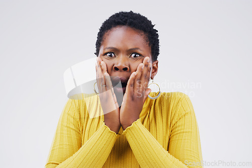 Image of Shock, scared and portrait of woman in a studio with a omg, wow or wtf facial expression for emotion. Fear, afraid and African female model with horror face for bad news isolated by white background.