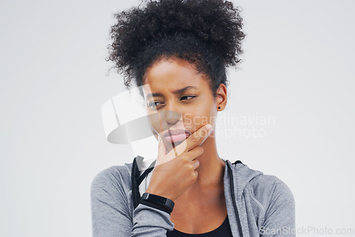 Image of Isolated, black woman and serious thinking of workout idea, fitness or planning exercise and health goals. Girl, think or plan decision for training, gym or remember sport ideas on white background