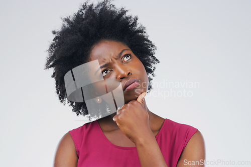 Image of Black woman, thinking and confused in studio with decision or choice on space pr grey background. Doubt, unsure and African female person contemplating, solution and emoji, puzzled and skeptical