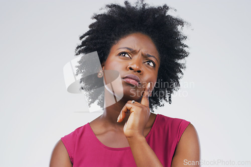 Image of Confused, thinking and black woman in studio with frown, decision or choice on grey background space. Doubt, suspicious and African female person concerned, unsure or pensive and contemplating