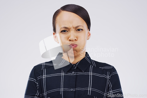 Image of Portrait, funny face and breath with a woman in studio on a gray background looking silly or goofy. Comedy, comic and frown with a crazy young female person joking indoor for quirky fun or humor