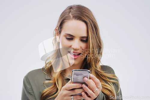 Image of Phone, surprise and face of woman in studio with smile for social media, internet and chatting online. Communication, white background and female person on smartphone for website, mobile app and text