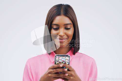 Image of Contact, smile and Indian woman with a phone, typing and connection against a studio white background. Female person, girl and model with a cellphone, internet and search website for information
