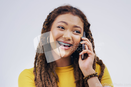 Image of Phone call, funny and woman talking in studio isolated on a white background. Cellphone, laughing and African female person in communication, speaking or discussion, comedy or comic, meme and excited