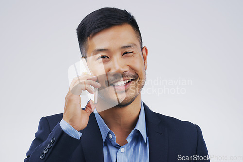 Image of Phone call, smile and portrait of Asian man talking in studio isolated on a white background. Cellphone, happy and face of business person in communication, speaking or discussion, network and chat.