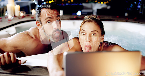 Image of Tablet, spa and crazy couple take selfie with tongue for social media or the internet or online for a romantic night date. Celebration, web or funny face by people on vacation or holiday in a hot tub