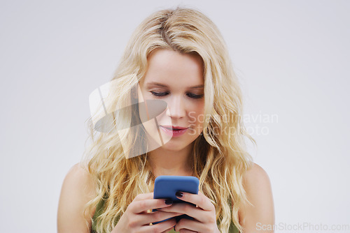 Image of Phone, social media and woman in studio typing message, browse internet and online chat. Communication mockup, white background and female person on smartphone for website, mobile app and networking