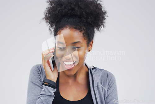 Image of Phone call, funny and black woman talking in studio isolated on a white background with mockup. Cellphone, excited and African female person in communication, speaking or discussion, network or chat.
