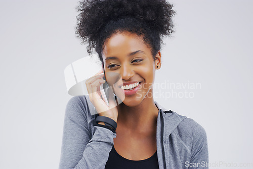 Image of Phone call, smile and black woman speaking in studio isolated on a white background with mockup. Cellphone, happy and African female person in communication, conversation or discussion with contact.