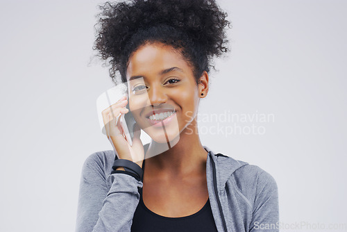 Image of Phone call, smile and portrait of black woman talking in studio isolated on a white background with mockup. Cellphone, happy and face of African female person in communication, speaking or discussion