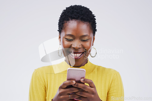 Image of Social media, black woman on smartphone and smile against a white background. Connectivity or technology, communication or texting and African female person happy with cellphone in a studio backdrop