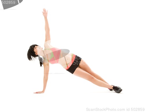 Image of woman practicing ashtanga yoga posture