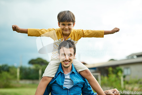 Image of Portrait, kids and a son on back of his dad outdoor in the garden to fly like an airplane while bonding together. Family, children and a father carrying his boy child while playing a game in the yard