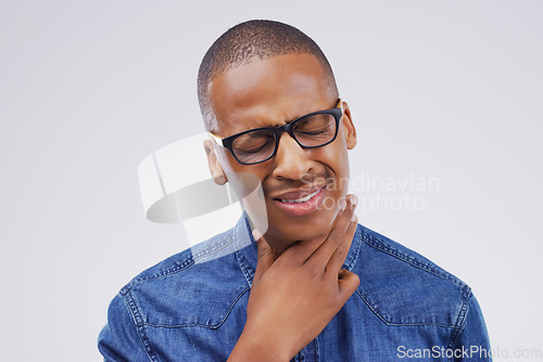 Image of Black man, sore throat and virus in pain, allergies or bacteria against a white studio background. Sick African male person touching neck from cough, allergy or flu of cold, illness or infection