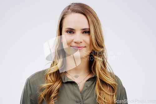 Image of Portrait, happy and smile with a woman in studio on a white background for contemporary style. Face, confident or natural with an attractive young german female model posing alone in trendy fashion