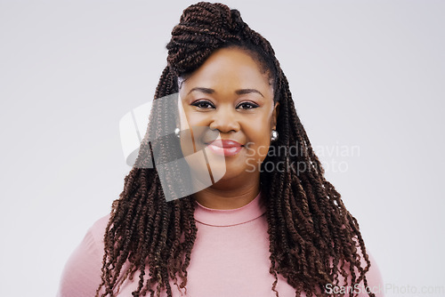 Image of Portrait, smile and braids with a black woman in studio on a gray background for beauty or fashion. Face, happy and natural with an attractive young female person feeling confident in trendy clothes