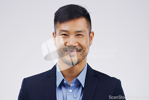 Image of Portrait, entrepreneur and Asian man with a corporate career and confident agent against a white studio background. Face, male person and lawyer in a suit, professional and employee with happiness